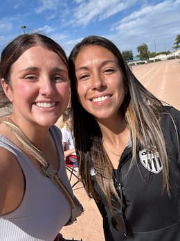 Coach Lexi and Coach Karen smiling together